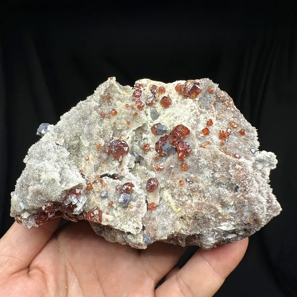 Red gem sphalerite crystals with galena on white quartz-calcite plate from Hunan, China, detail of the matrix contact