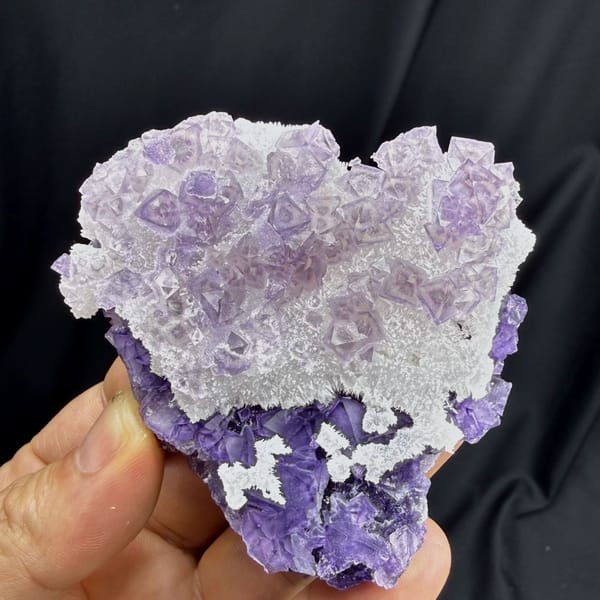 Green-core octahedral purple fluorite on quartz — detail view