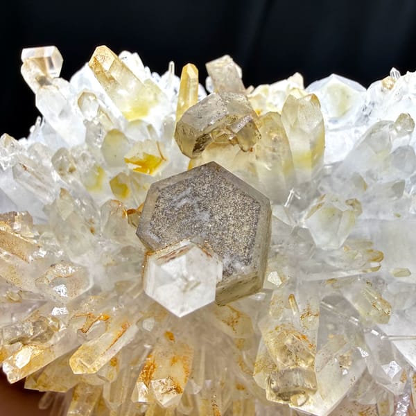Hexagonal platy calcite on golden quartz cluster — alternate view