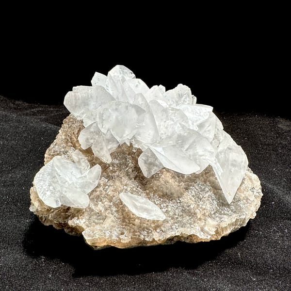 Calcite and fluorite, from Fujian, China, front view in daylight, held in hand