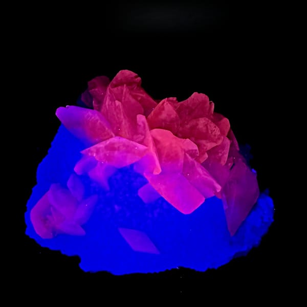 Calcite and fluorite under UV light, from Fujian, China