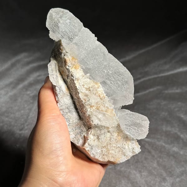 White baryte column with glassy tabular blades from Sichuan, China, close-up of the crystal faces