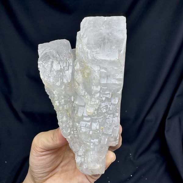 Large white baryte floater of stacked tabular blades from Jinkouhe, Sichuan, China, detail of the matrix contact