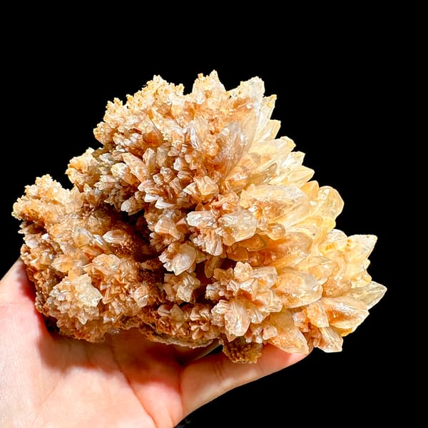 Large peach calcite cluster with sparkling crystal skins from Yunnan, China, second angle