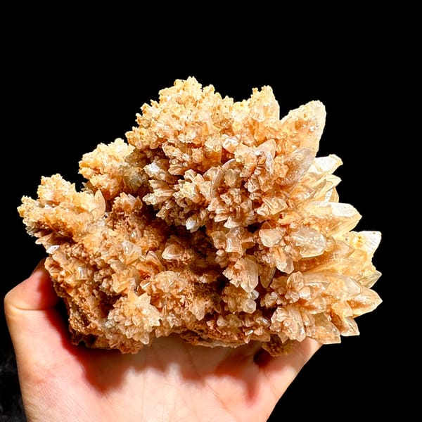 Large peach calcite cluster with sparkling crystal skins from Yunnan, China, top view