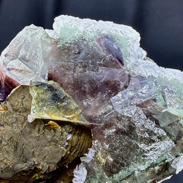 Pale purple phantom fluorite with pyrrhotite and calcite from Inner Mongolia, China, close-up of the crystal faces