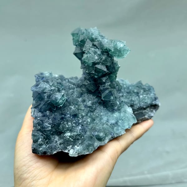 Teal-green octahedral fluorite tower on dark quartz plate from Inner Mongolia, China, second angle