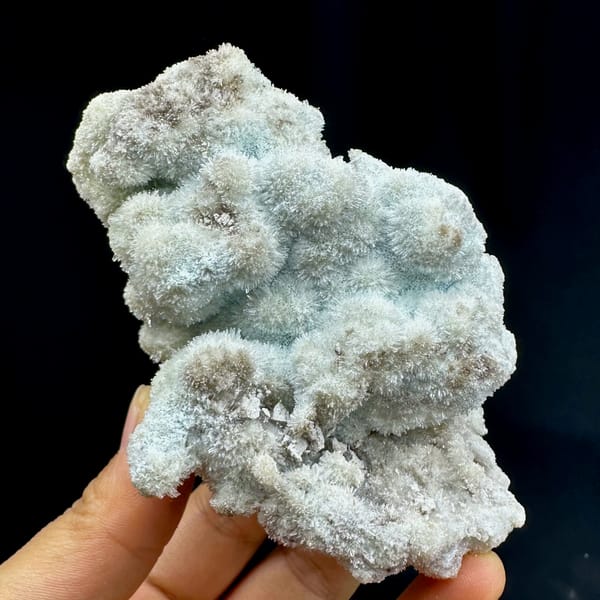 Fuzzy blue-green creedite balls in branching cluster from Guizhou, China, top view