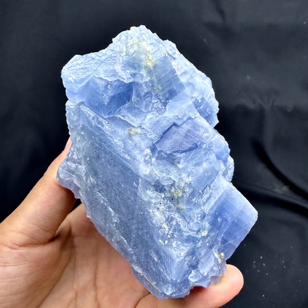Block of pale blue calcite with peridot grains from Vietnam, reverse side