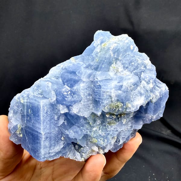 Block of pale blue calcite with peridot grains from Vietnam, top view