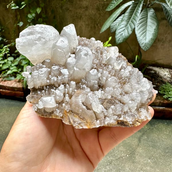 Pale plate of stubby prismatic calcite crystals from Guangxi, China, side view