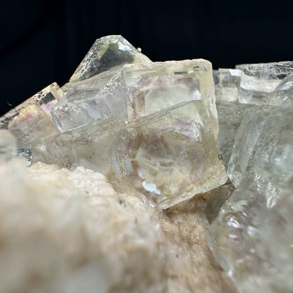 Purple-blue fluorite cubes with calcite, from Shangbao Mine, Hunan, China, close-up of the crystal faces