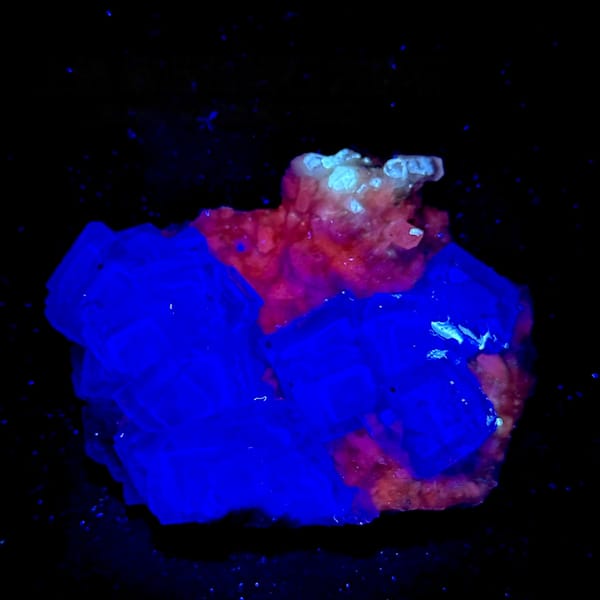 Purple-blue fluorite cubes with calcite, from Shangbao Mine, Hunan, China, detail of the matrix contact