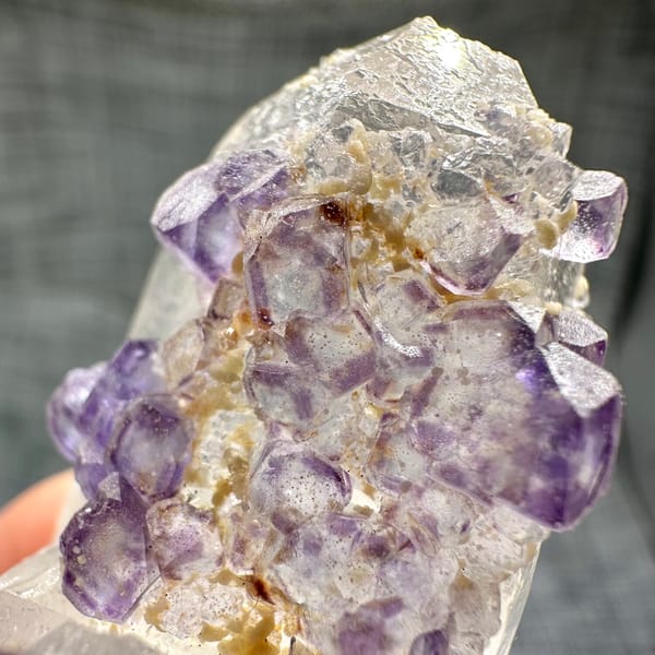 Clear quartz crystal with chain of purple fluorite cubes from Yaogangxian Mine, Hunan, China, overall view