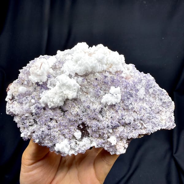 Lavender fluorite plate frosted with white gypsum from Guizhou, China, detail of the matrix contact