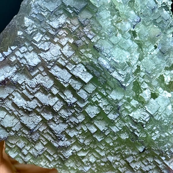 Purple-rimmed green stepped fluorite plate from Jiangxi, China, close-up of the crystal faces