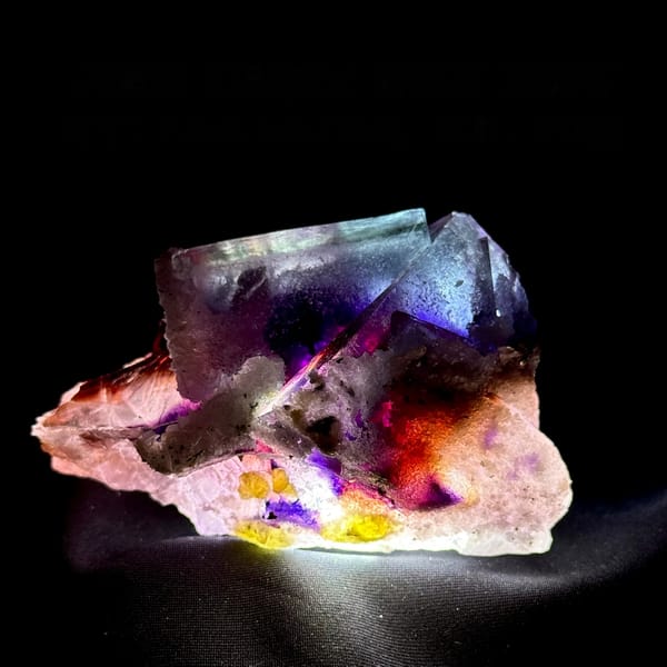 Phantom purple fluorite glowing when back-lit, from Inner Mongolia, China