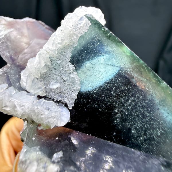 Phantom purple fluorite glowing when, from Inner Mongolia, China, reverse side