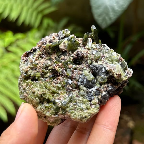 Green diopside crystals with garnet and galena from Inner Mongolia, China, side view