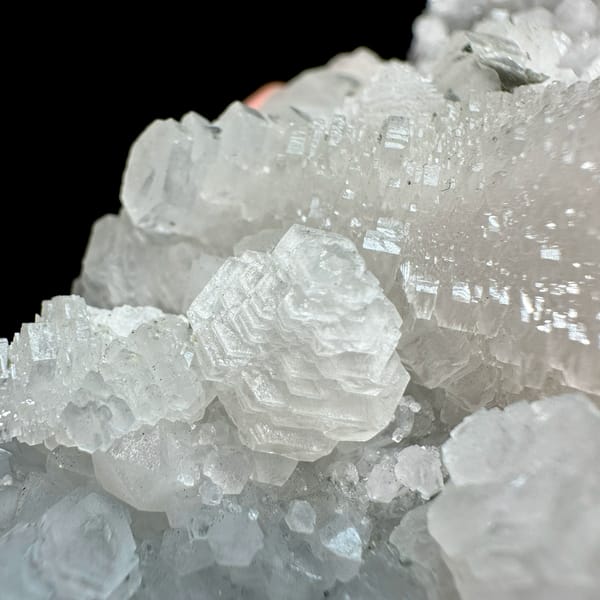 Floater of stepped white calcite with quartz from Guangdong, China, close-up of the crystal faces