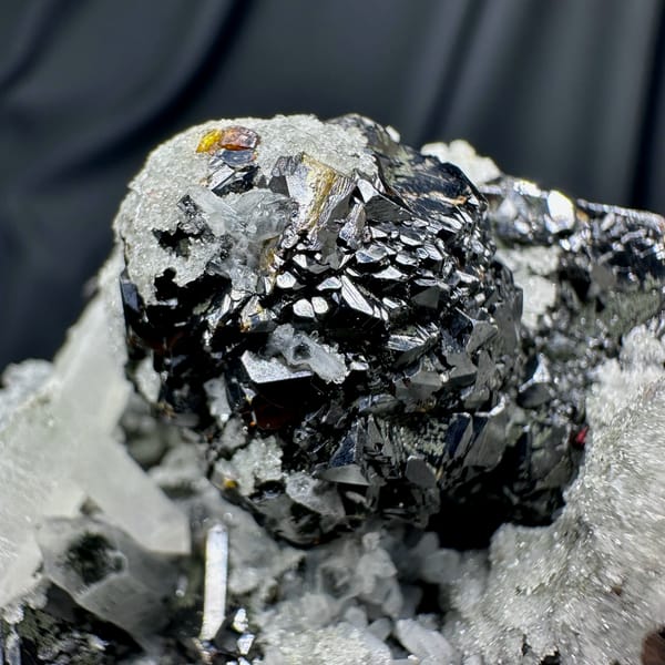 Black botryoidal marmatite with clear quartz needles from Inner Mongolia, China, reverse side