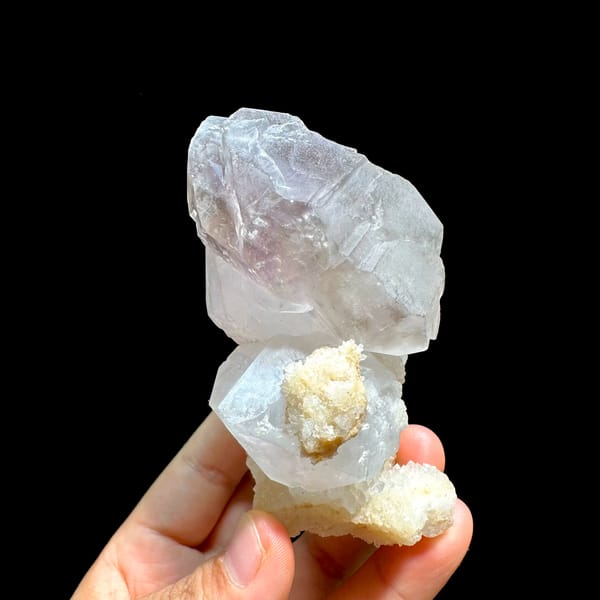 Pale purple and white cathedral quartz group from Brazil, close-up of the crystal faces