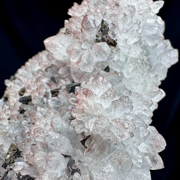 Pale red hematoid quartz crystals with chalcopyrite from Jiangxi, China, reverse side