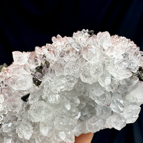 Pale red hematoid quartz crystals with chalcopyrite from Jiangxi, China, top view