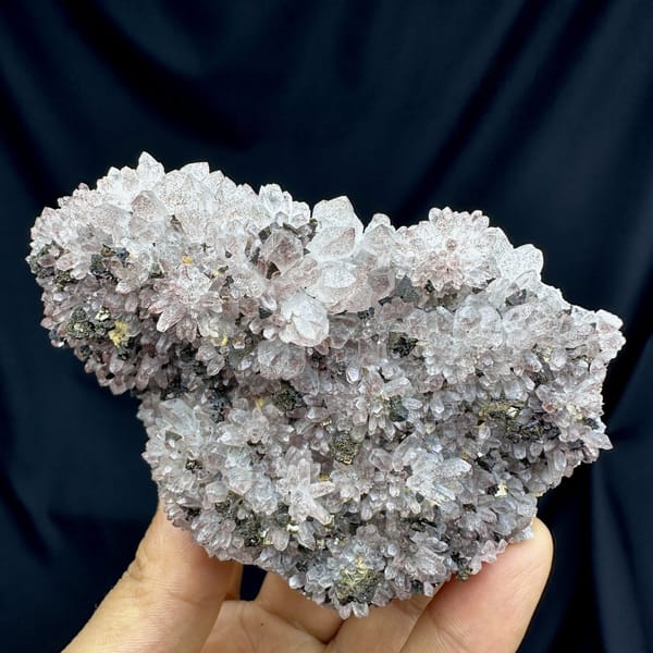 Pale red hematoid quartz crystals with chalcopyrite from Jiangxi, China, detail of the matrix contact