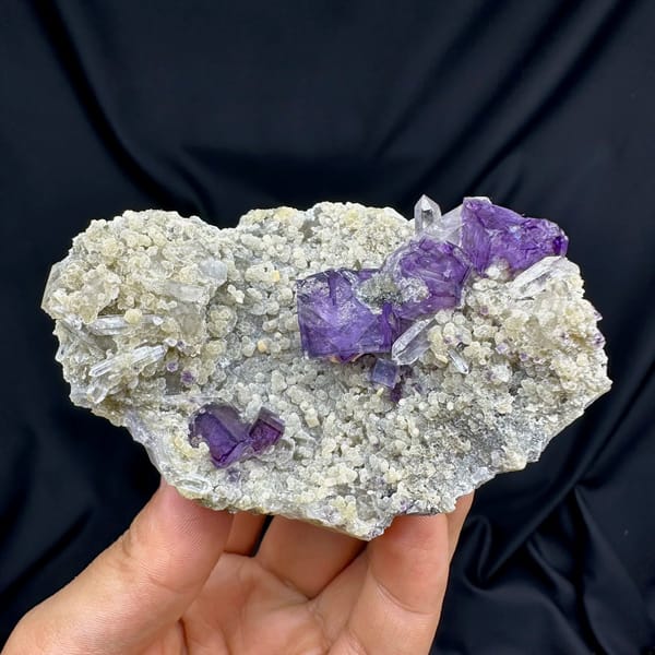 Deep purple fluorite cubes on tan quartz and mica from Yaogangxian Mine, Hunan, China