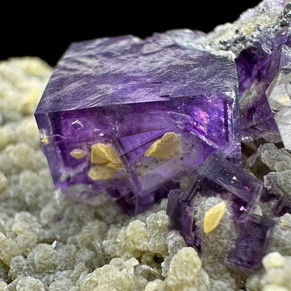Deep purple fluorite cubes on tan quartz and mica from Yaogangxian Mine, Hunan, China, top view