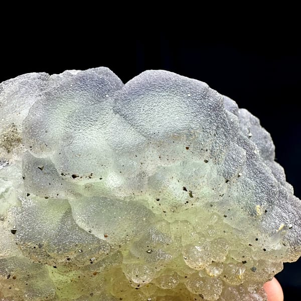 Frosted purple-green fluorite balls dusted with pyrite from Jiangxi, China, top view