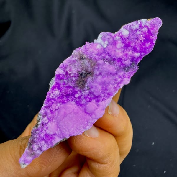 Slender wedge of vivid magenta aragonite from Yunnan, China, second angle