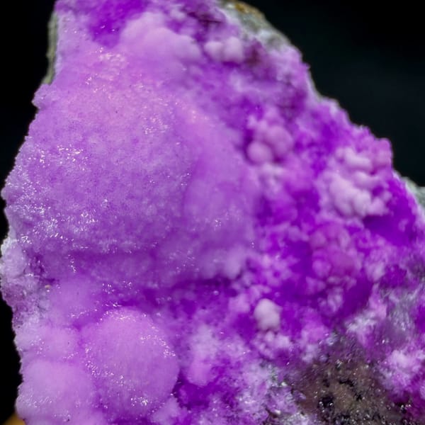 Slender wedge of vivid magenta aragonite from Yunnan, China, reverse side