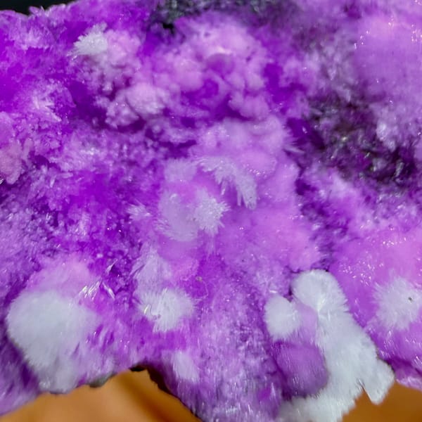 Slender wedge of vivid magenta aragonite from Yunnan, China, top view