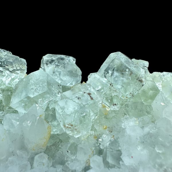 Plate of pale green fluorite cubes with inclusions on white quartz from Guangdong, China, reverse side