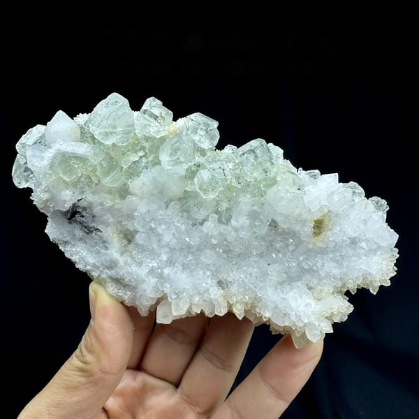 Plate of pale green fluorite cubes with inclusions on white quartz from Guangdong, China, detail of the matrix contact