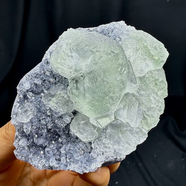 Pale green fluorite cubes in lavender quartz-druse pocket from Fujian, China, second angle