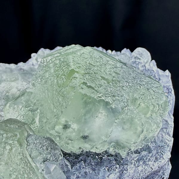 Pale green fluorite cubes in lavender quartz-druse pocket from Fujian, China, reverse side