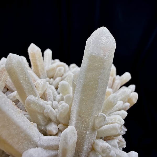 Sugar-textured pale quartz needles in spiky cluster from Guangdong, China, reverse side