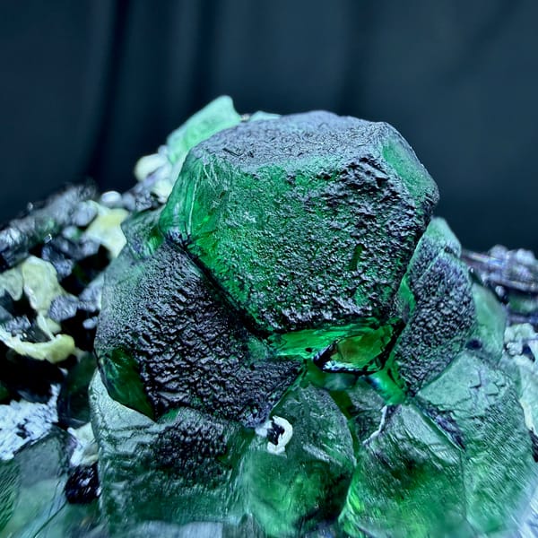 Emerald-green garden fluorite cubes with black tourmaline from Namibia, second angle