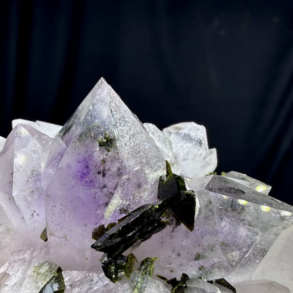 Pale lilac garden-quartz rosette with dark green epidote from Sichuan, China, close-up of the crystal faces