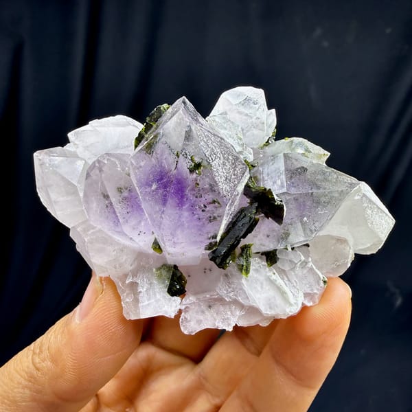 Pale lilac garden-quartz rosette with dark green epidote from Sichuan, China, top view