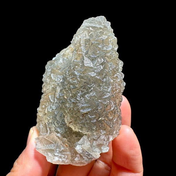 Grey-green fluorite mass sprinkled with pyrite from Xianghualing, Hunan, China, second angle
