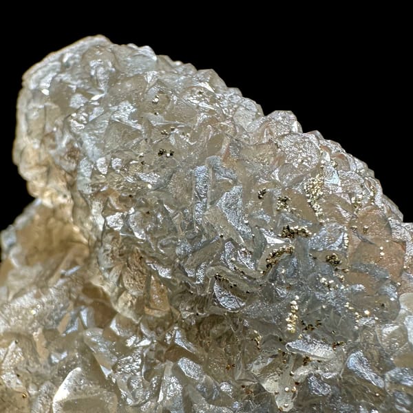 Grey-green fluorite mass sprinkled with pyrite from Xianghualing, Hunan, China, reverse side
