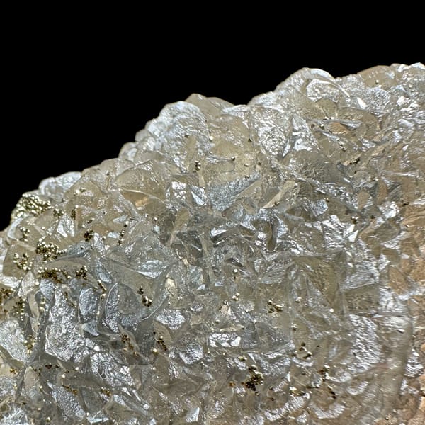 Grey-green fluorite mass sprinkled with pyrite from Xianghualing, Hunan, China, top view