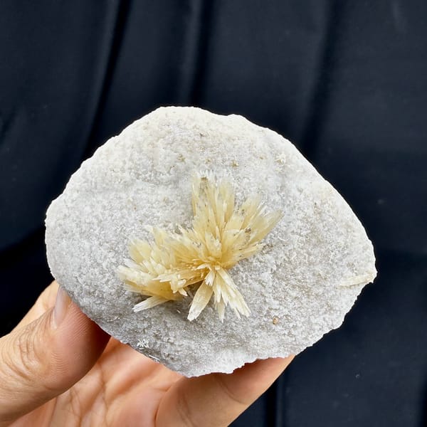Golden radiating calcite spray on white calcite ball from Yunnan, China, second angle
