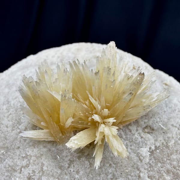 Golden radiating calcite spray on white calcite ball from Yunnan, China, reverse side