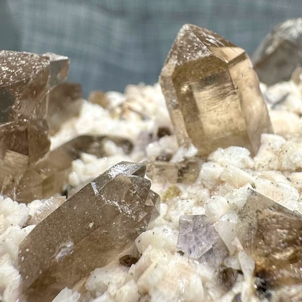 Smoky quartz points on cream feldspar from Yunxiao, Fujian, China, reverse side