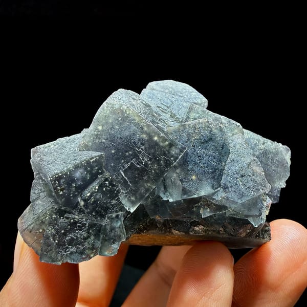 Blue-green daylight fluorite cubes enclosing pyrite from Nigeria, second angle